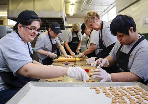Group of Employees Making Treats Together