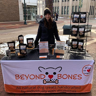 Beyond Bones Business Manager Lisa Roussin Infront Of Booth